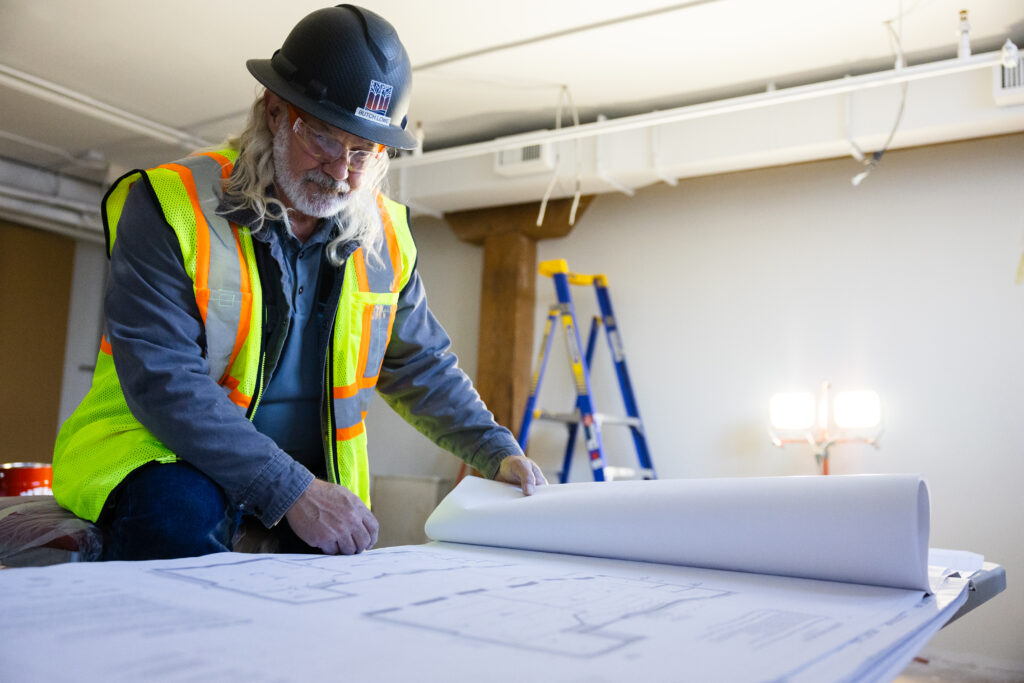 Riverstone contractor reviewing plans